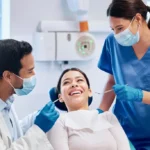 Hygienist performing a routine dental cleaning at Southwest Family Dentistry in Littleton, CO.