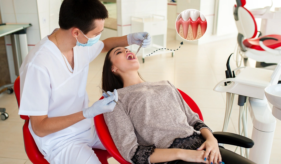 Dentist examining a patient's gums to check for signs of gum disease