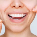 patient flossing to prevent gum disease, Southwest Family Dentistry Littleton CO